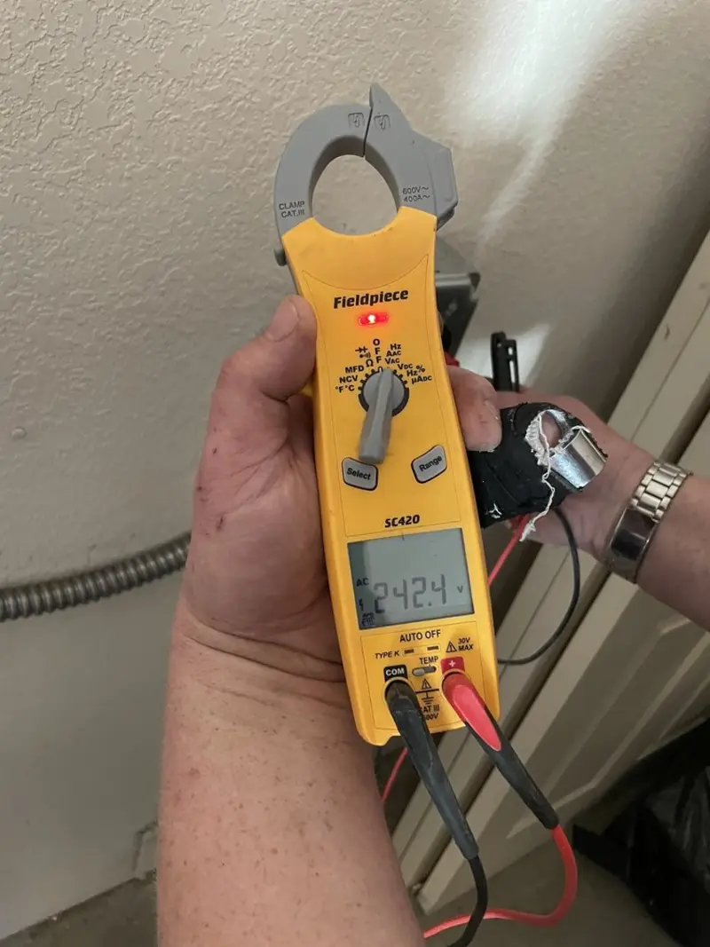 Voltage testing with clamp meter during Electrical Installation Services in Templeton